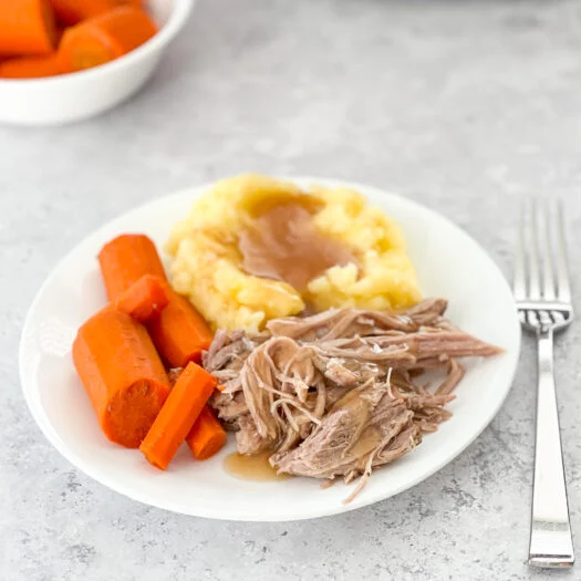 tender pork roast with carrots and homemade gravy