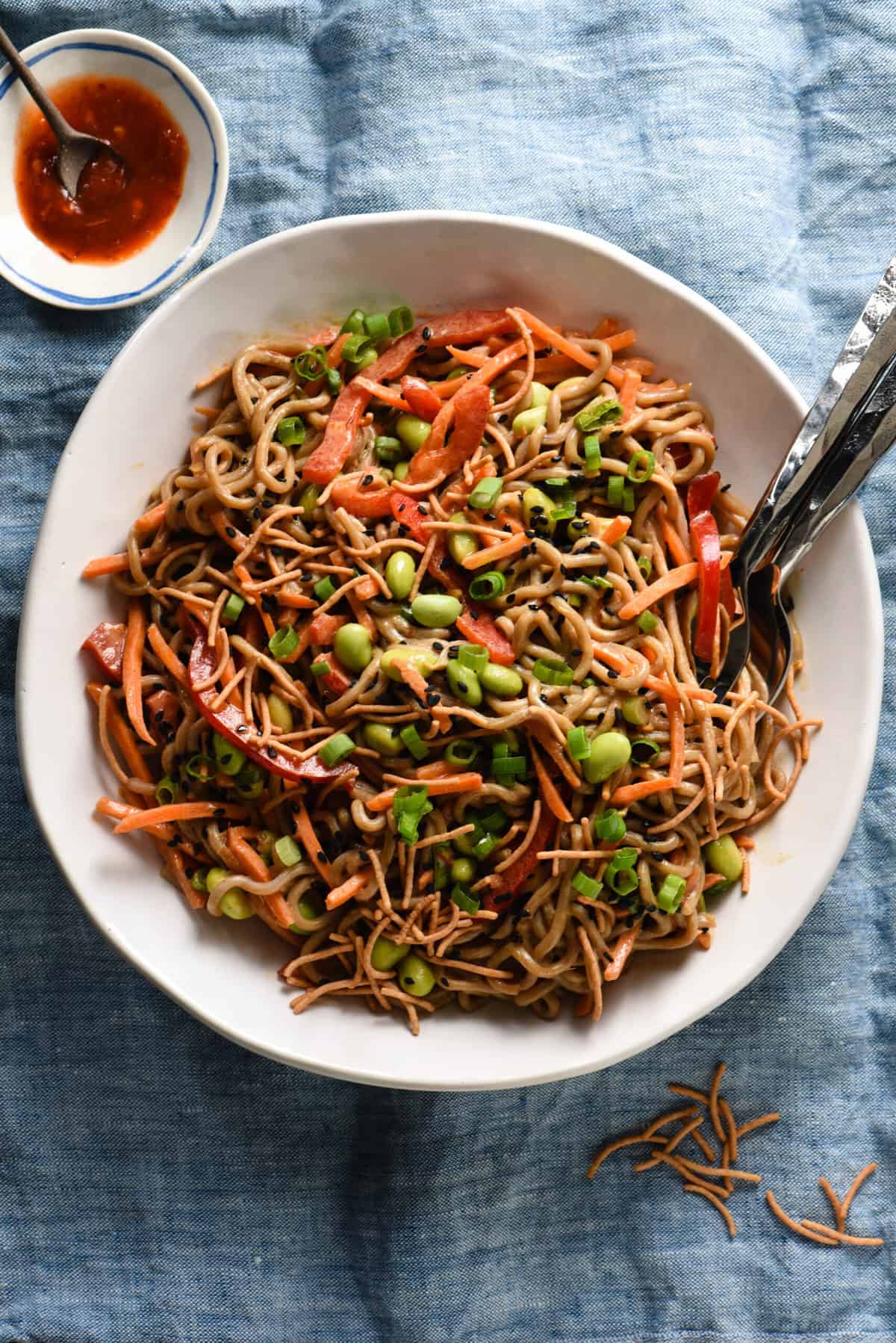 Asian noodle salad in jars with edamame and peanut sauce