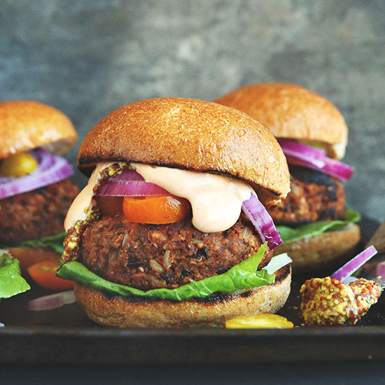 Easy grillable veggie burgers made with walnuts and black beans on a grill grate
