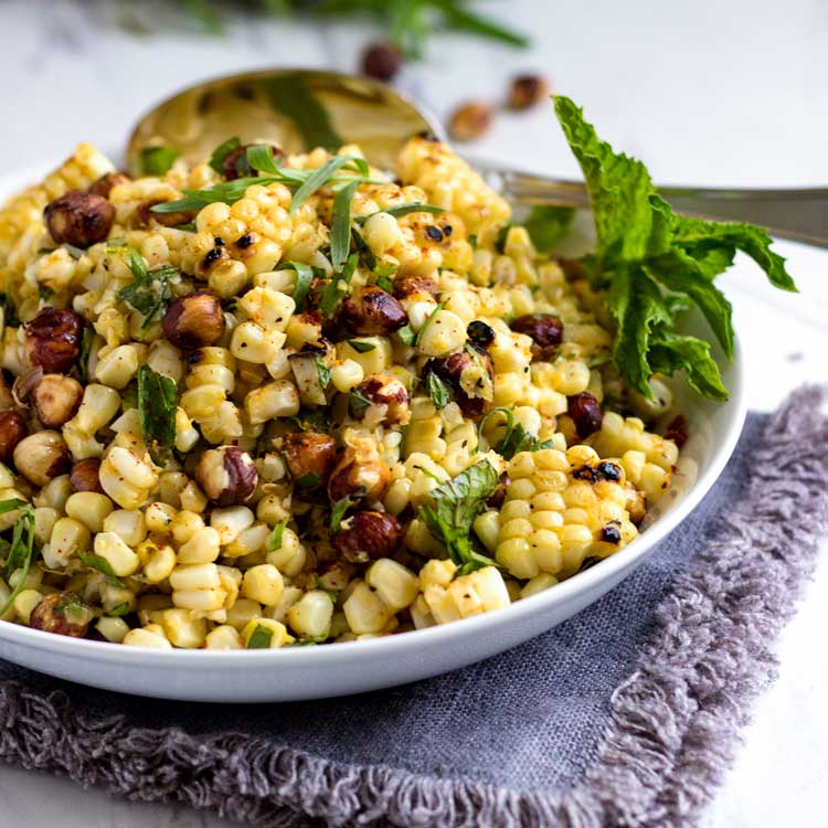 Grilled corn salad with toasted hazelnuts, fresh mint, tarragon and an orange vinaigrette