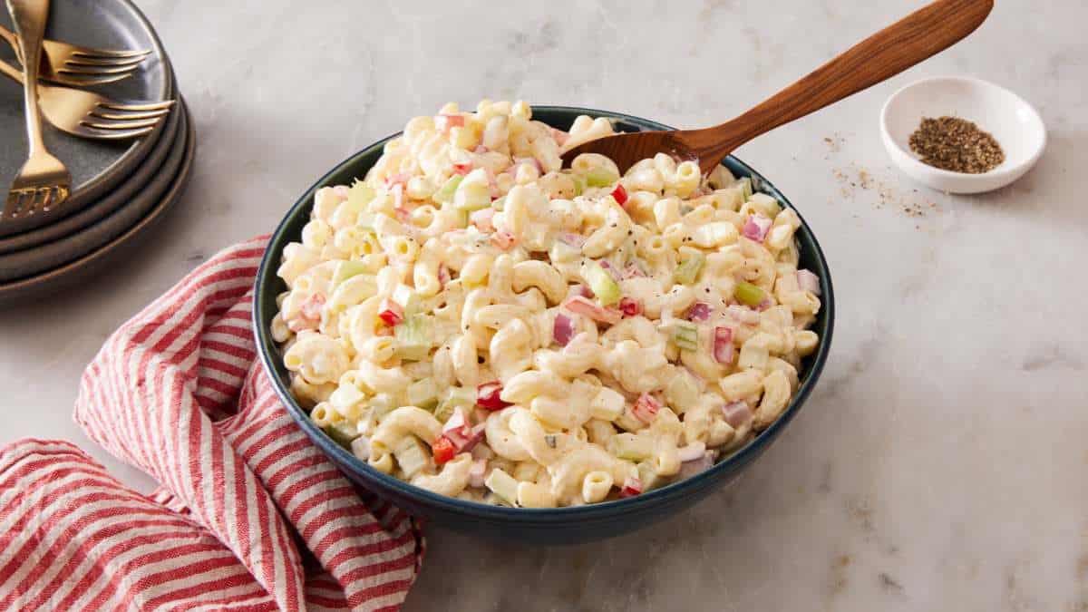 Classic creamy macaroni salad with hard-boiled eggs, celery, bell pepper and tangy dressing