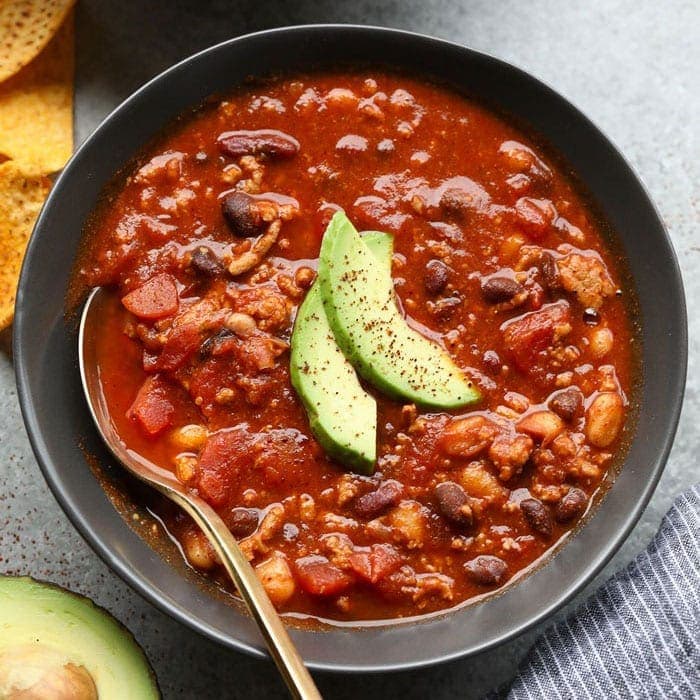 Slow cooker turkey salsa chili with three kinds of beans and diced tomatoes